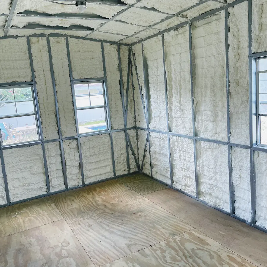 Closed-cell spray foam insulation applied to wall cavities in a residential project in Robeson
